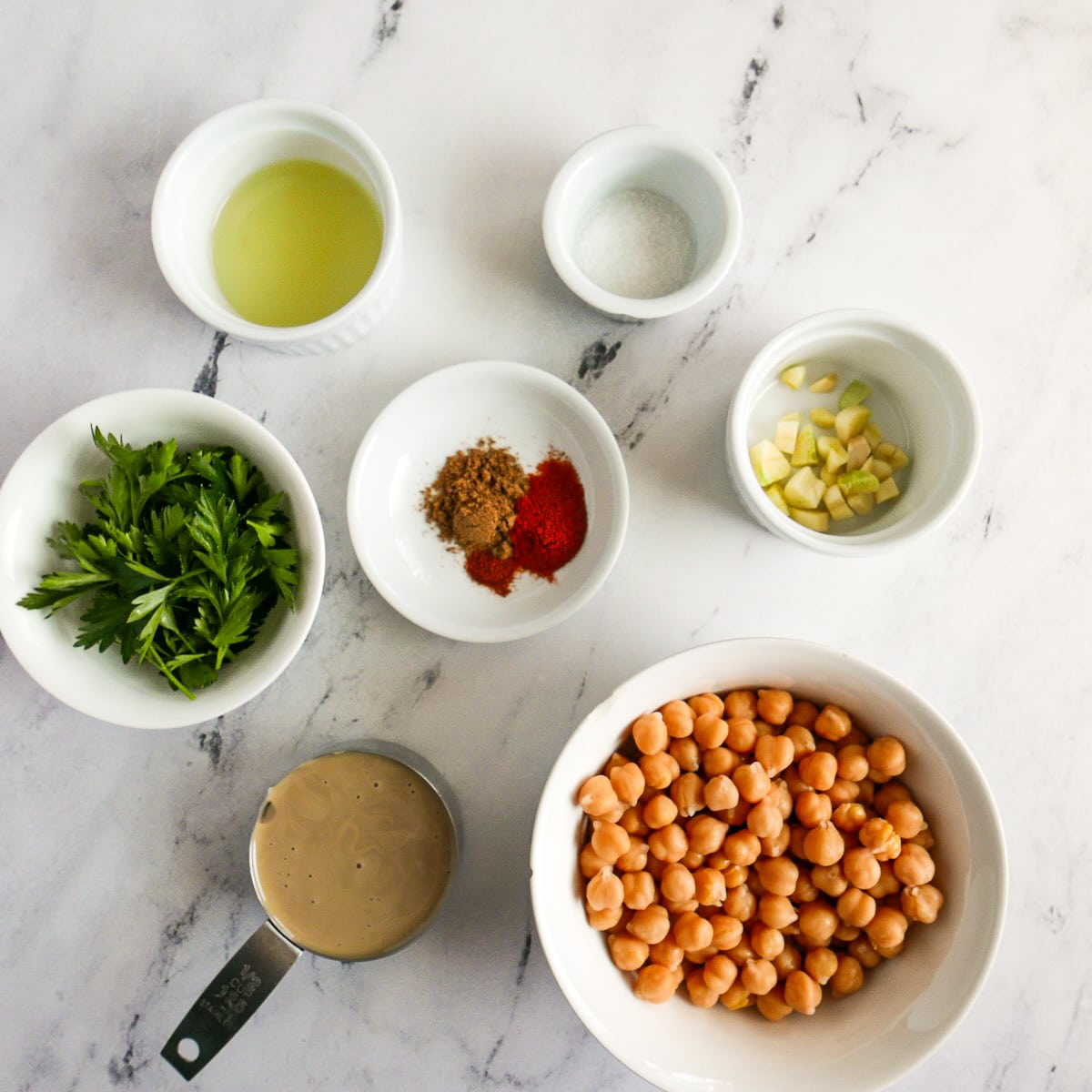 Hummus ingredients arranged on a table.