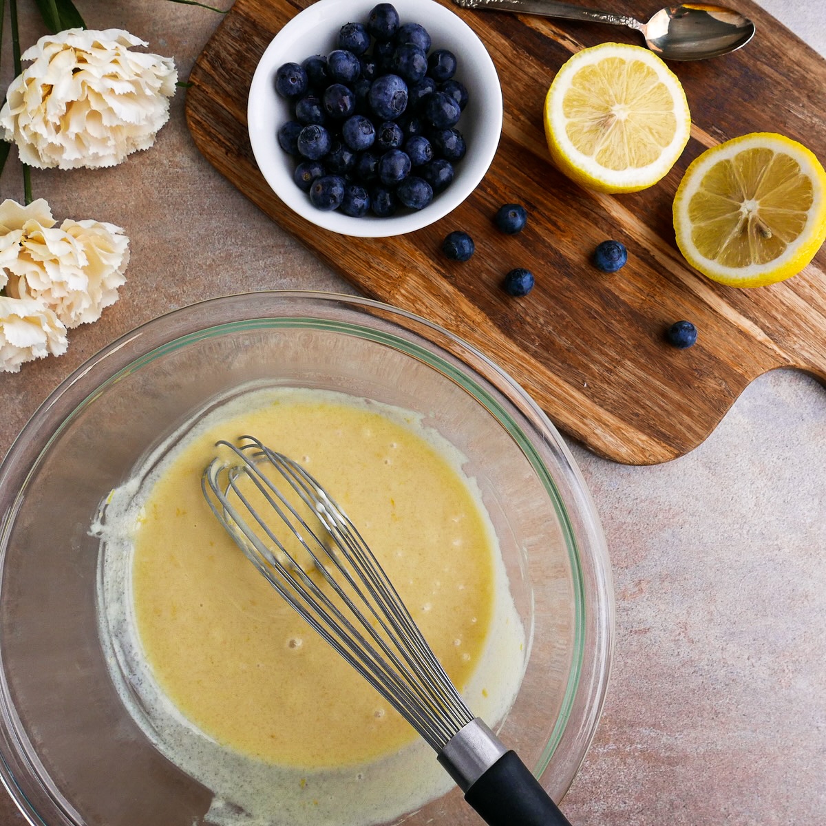 wet-ingredients.jpg Wet ingredients for blueberry muffins mixed in a large bowl.