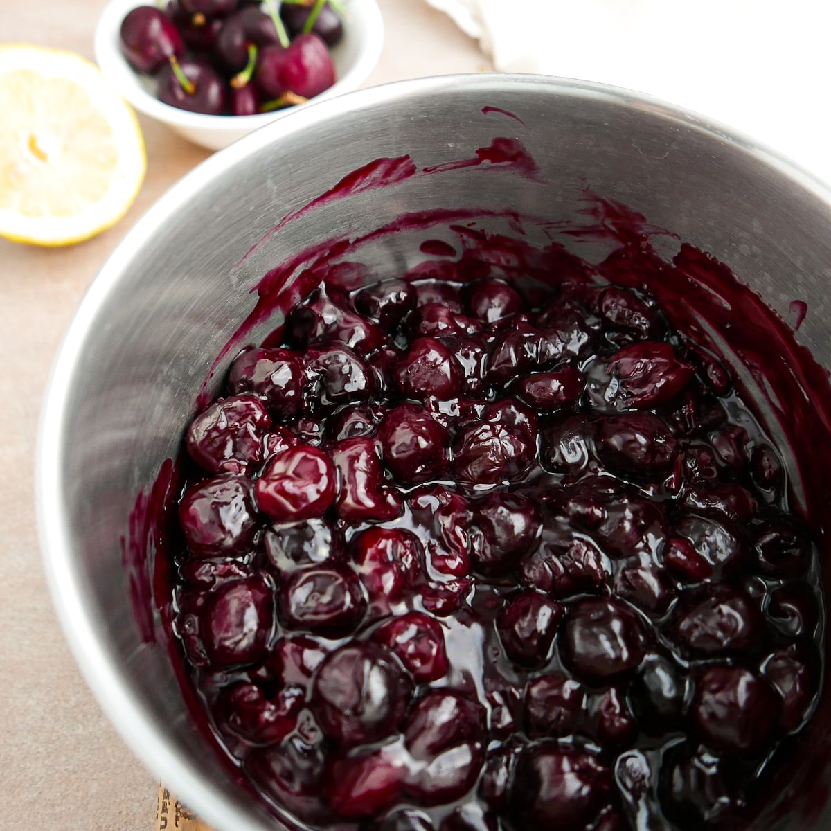 Cooked cherry filling in a saucepan. 