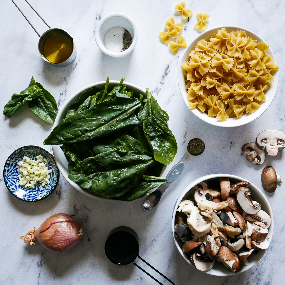 Pasta ingredients arranged on a table.