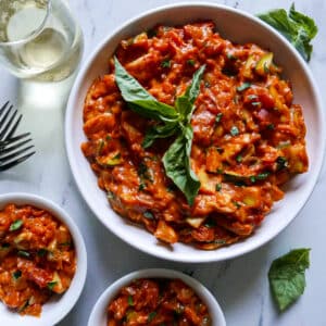 Creamy one pot vegetarian pasta in a large bowl with spoon.