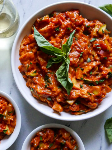 Creamy one pot vegetarian pasta in a large bowl with spoon.