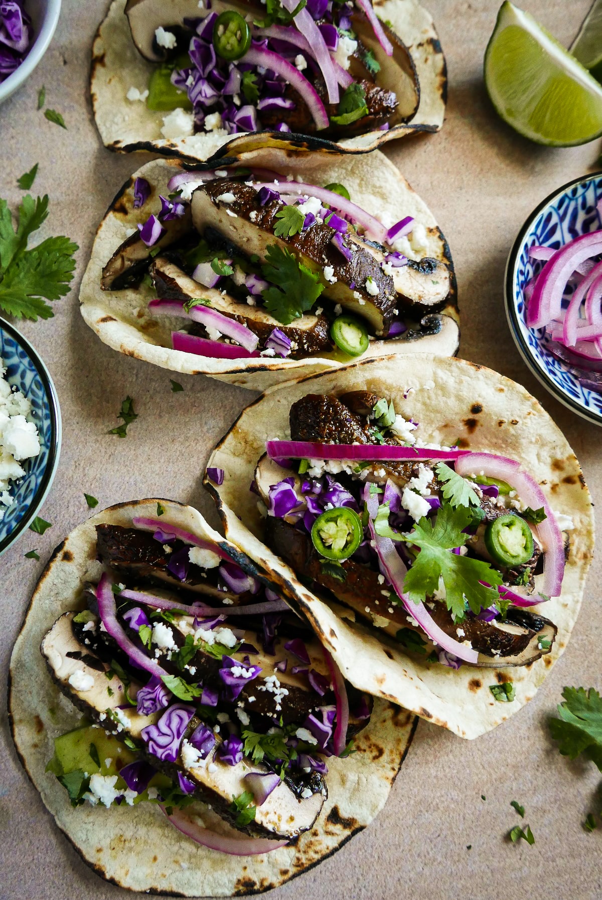 vegetarian-tacos.jpg Meaty vegetarian tacos garnished with toppings.