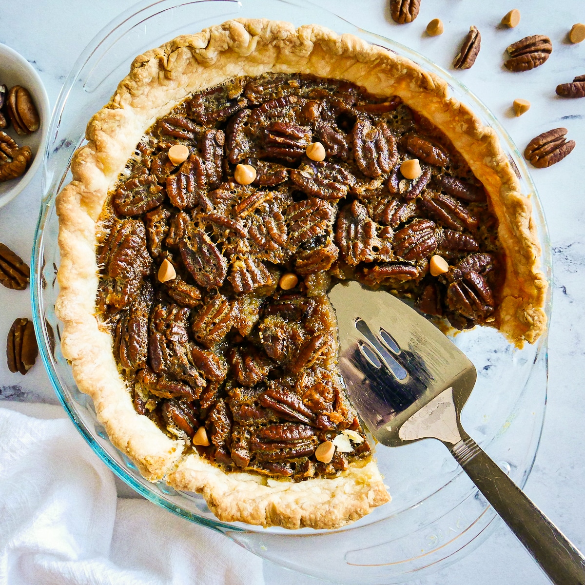 pie-server-in-pecan-pie.jpg pie server resting in a pan of gooey pecan pie.