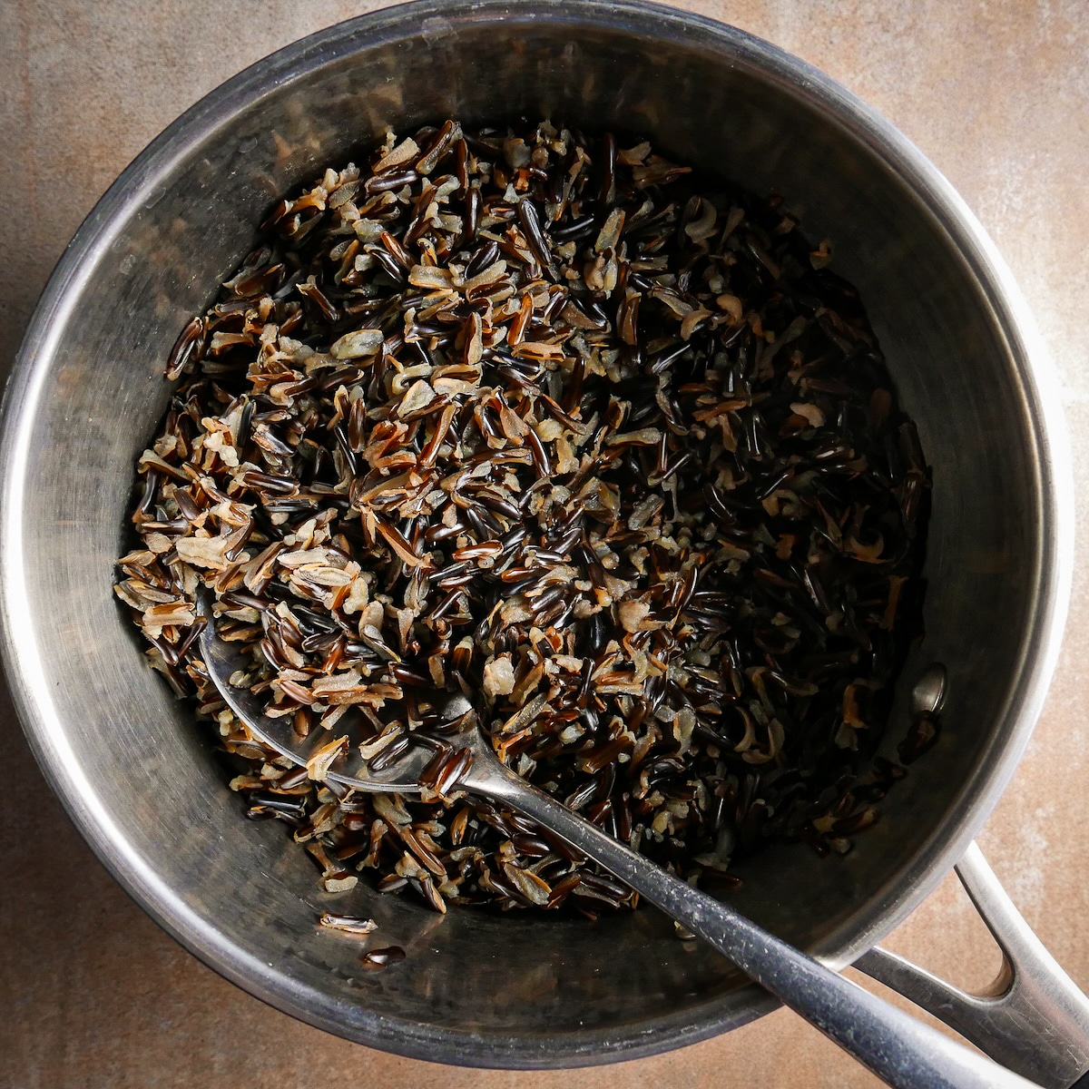 wild-rice.jpg Cooked wild rice in a small saucepan.