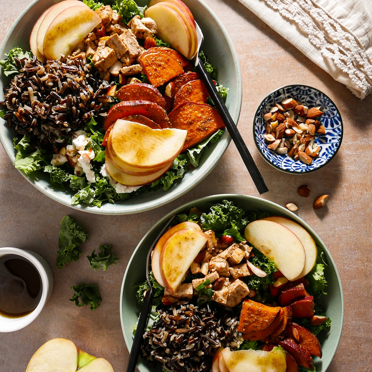 Two harvest bowls arranged on a table.