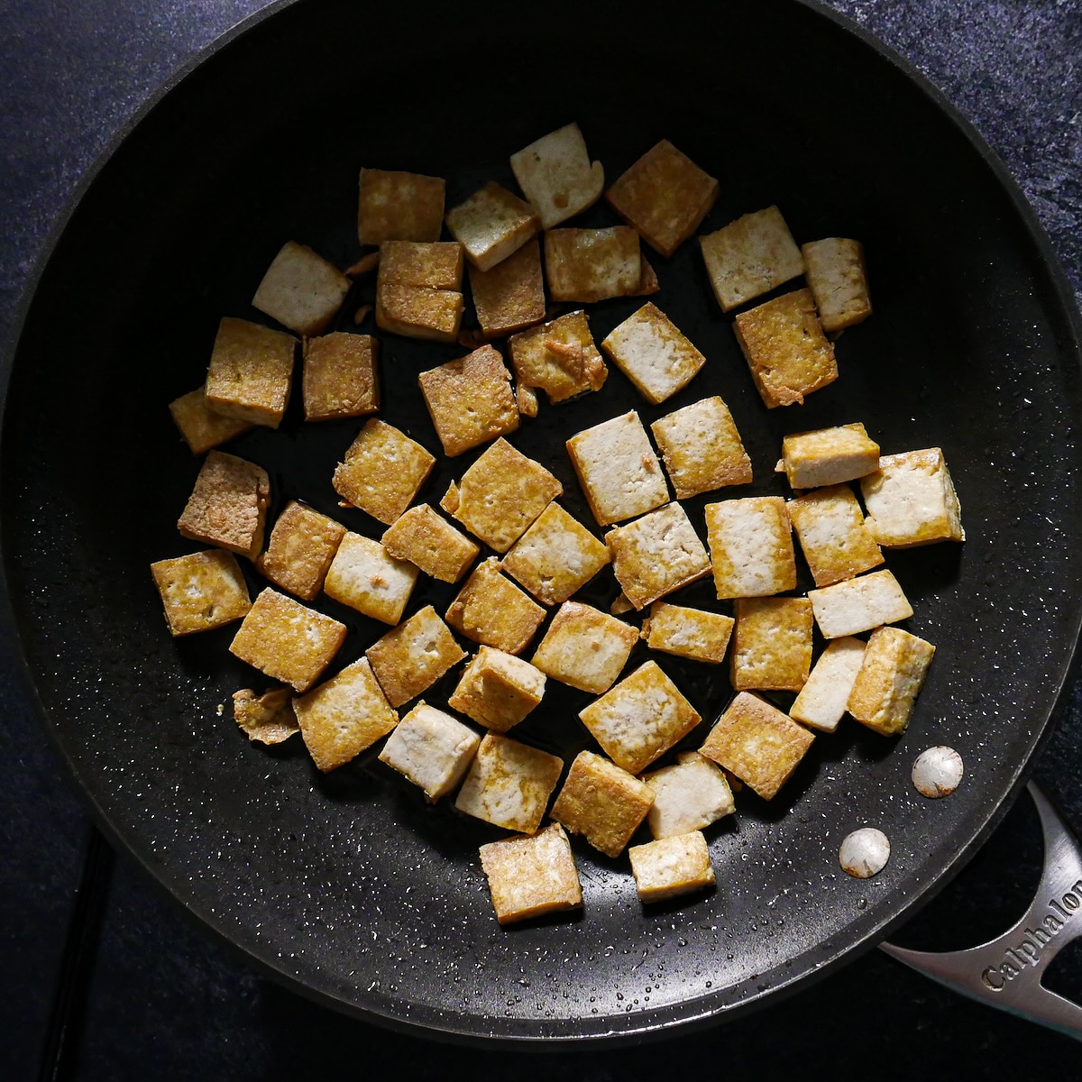 stir-fried tofu.jpg Stir fried tofu in a large skillet.