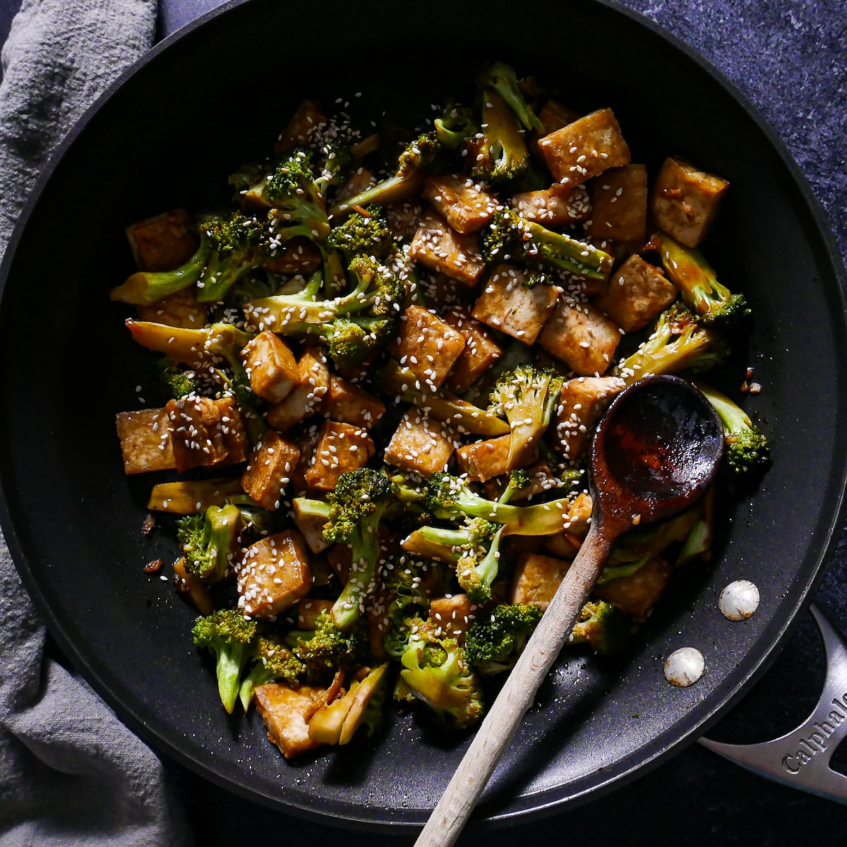 stir-fried-broccoli-and-tofu.jpg Stir fried tofu and broccoli with toasted sesame seeds in a wok.