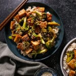 Saucy broccoli & tofu stir fry served on a plate.