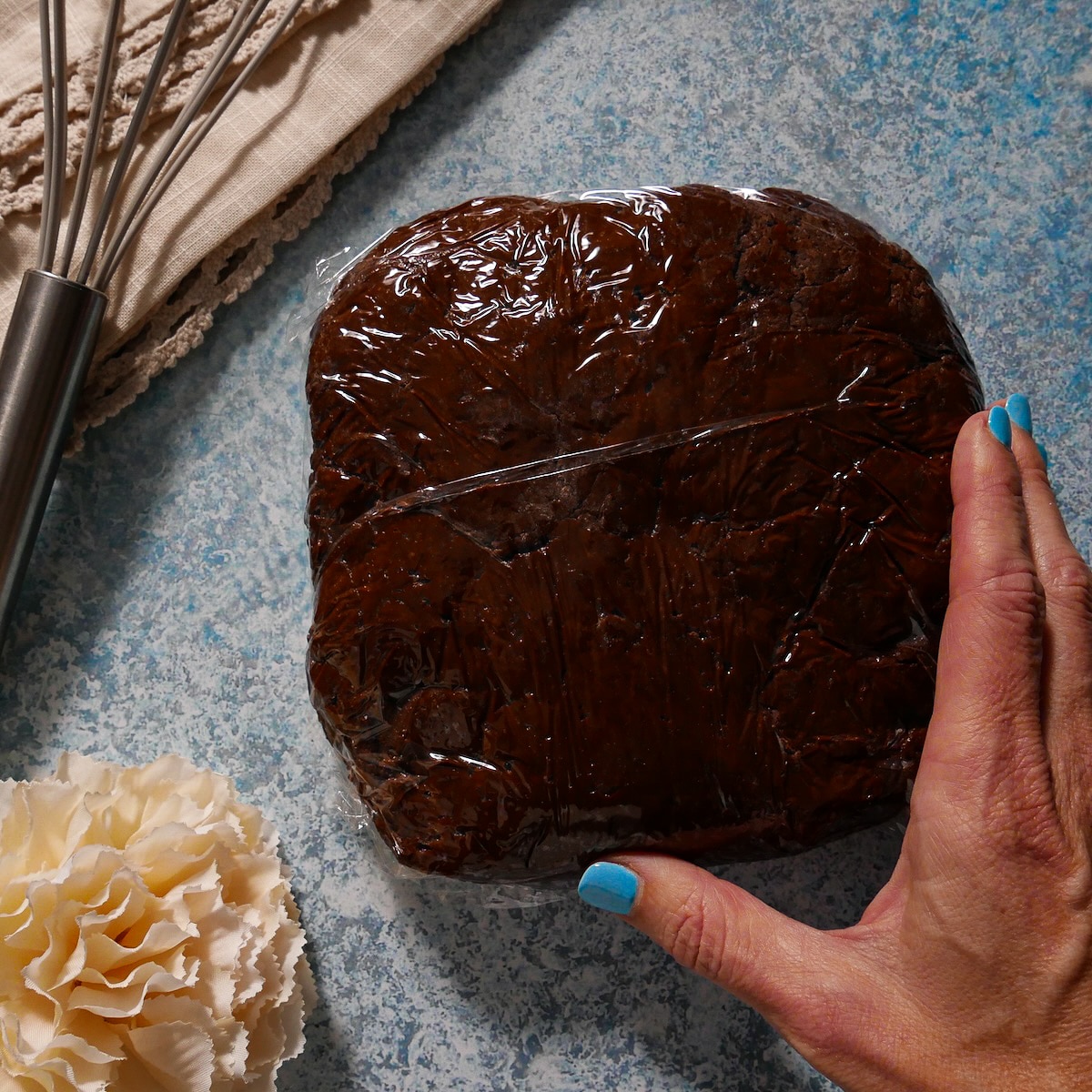 Dough wrapped in plastic wrap.