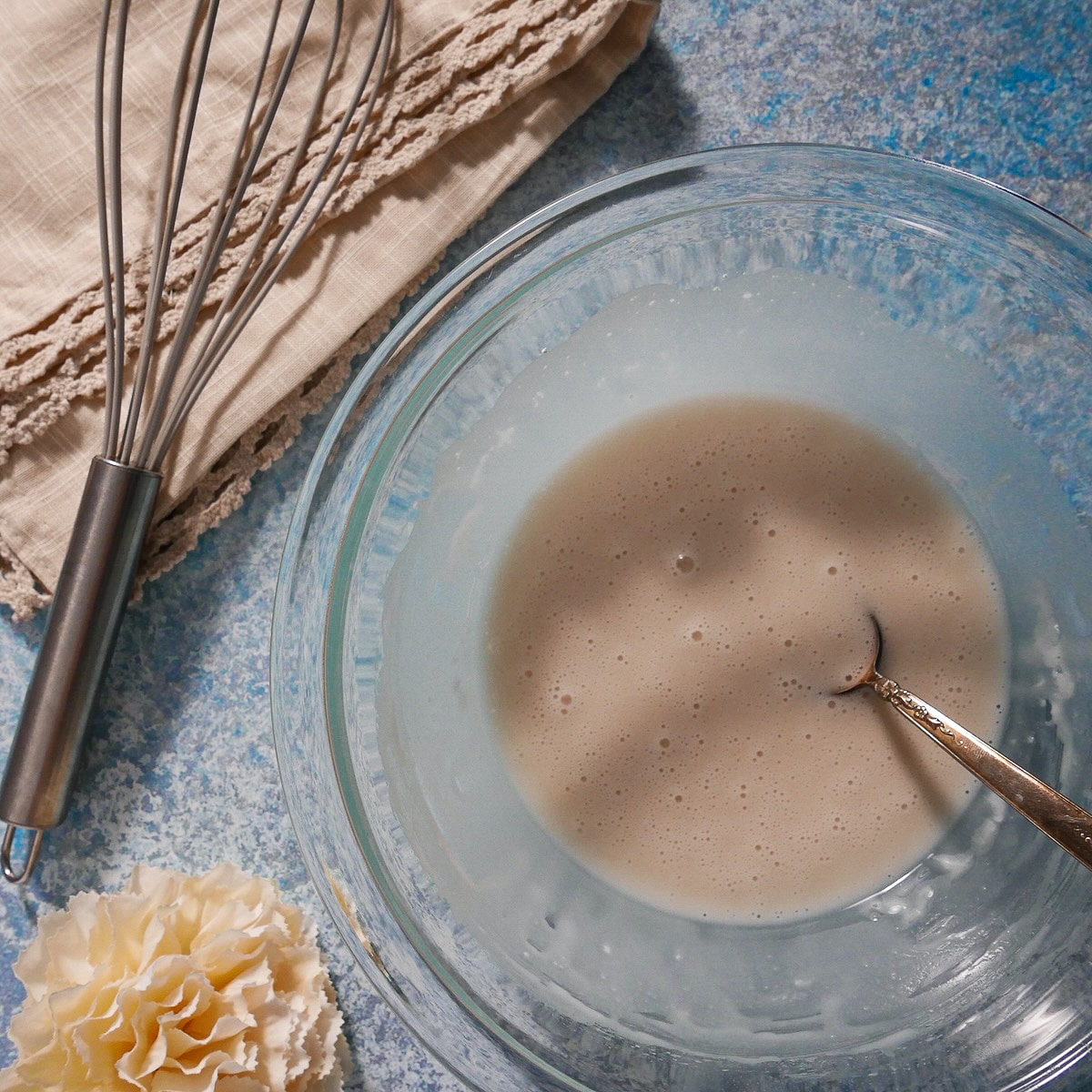 Vanilla glaze mixed together in a bowl.
