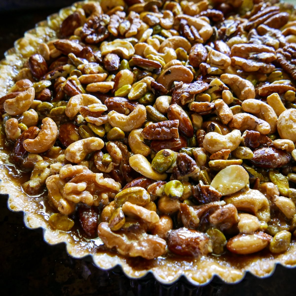 tart-shortbread-crust.jpg caramel nut filling poured into shortbread crust.