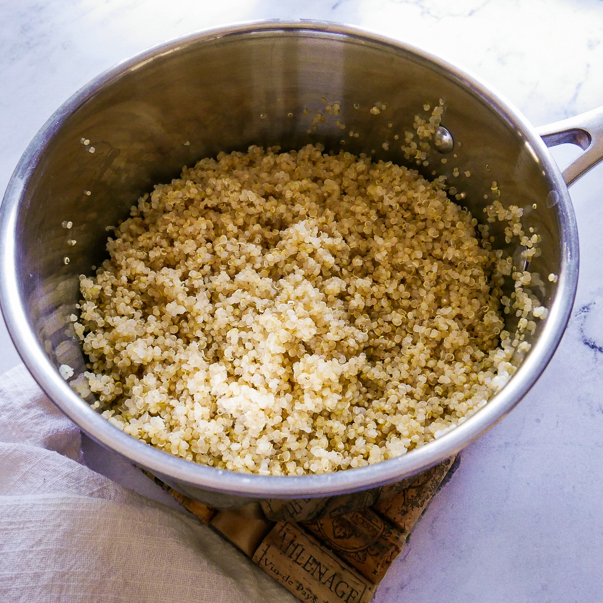 Cooked quinoa in a saucepan.