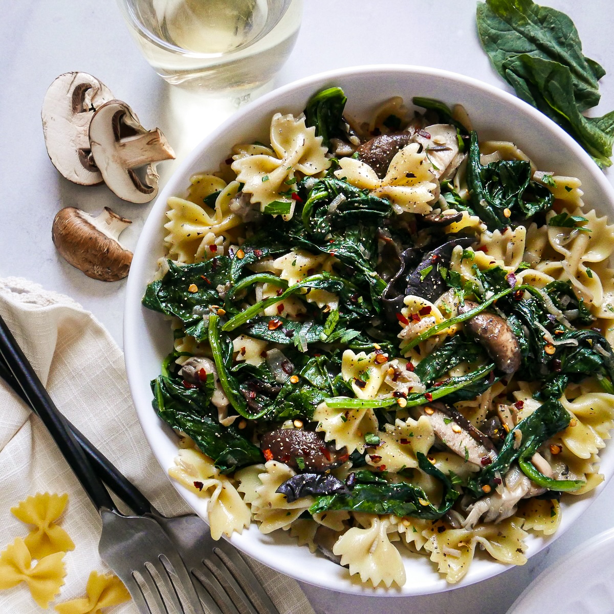 Vegetarian spinach mushroom pasta in a bowl. 