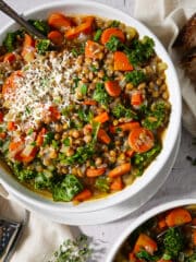 Easy vegetable lentil soup garnished with Parmesan cheese.