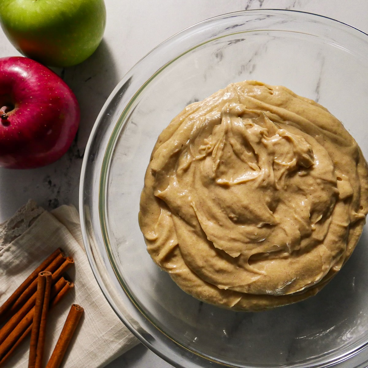 dry ingredients and sour cream mixed into cake batter.