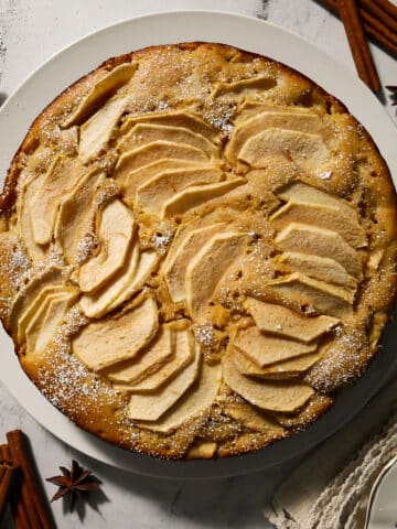 Easy apple cake served on a platter.