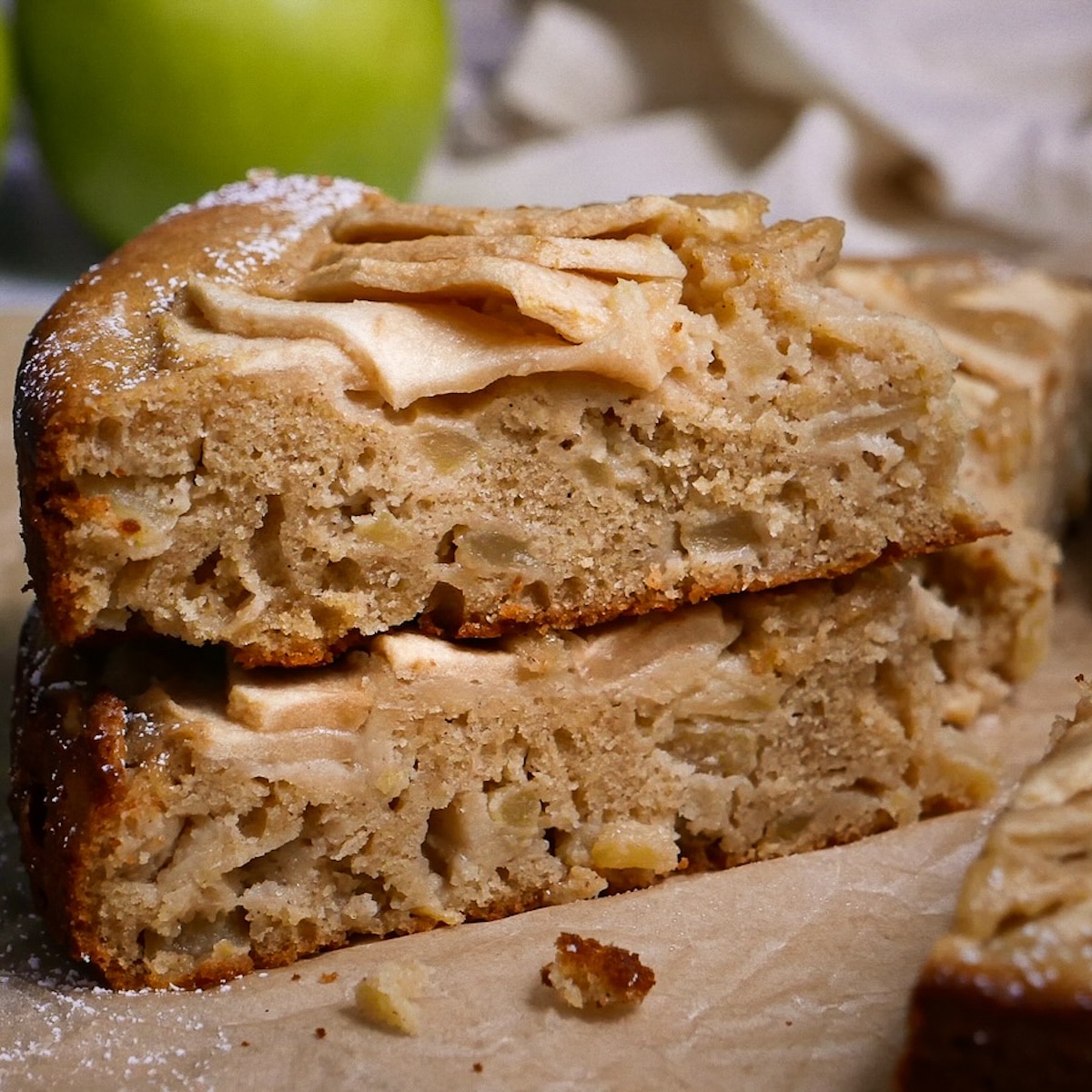 Slice of German apple cake being served.