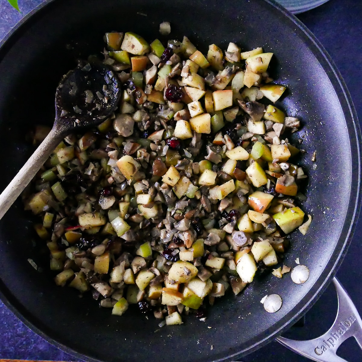 Diced apples, cranberries, and spices added to squash filling.