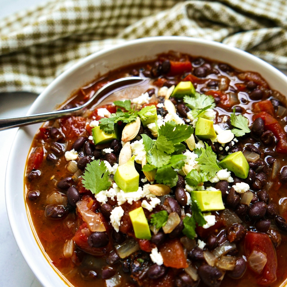 Easy black bean soup with cilantro and avocado.