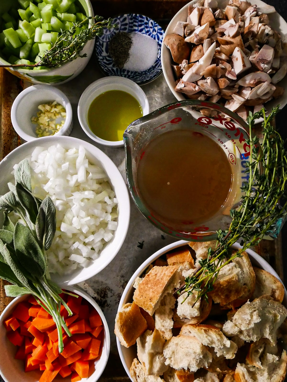 stuffing-ingredients.jpg Stuffing ingredients arranged on a baking sheet.