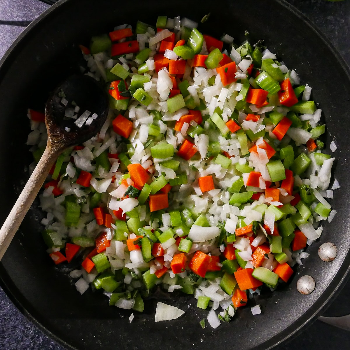 veggies-cooking.jpg Onion, carrots, and celery being cooked in butter.