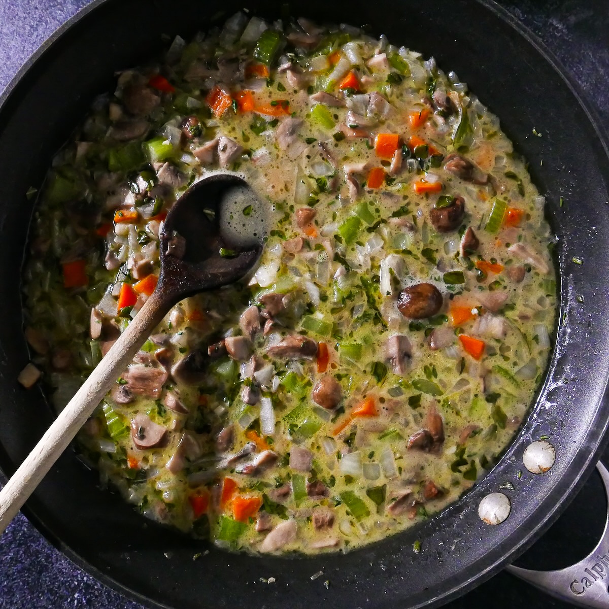 broth-and-veggies.jpg Vegetable broth added to vegetable mixture in pan.
