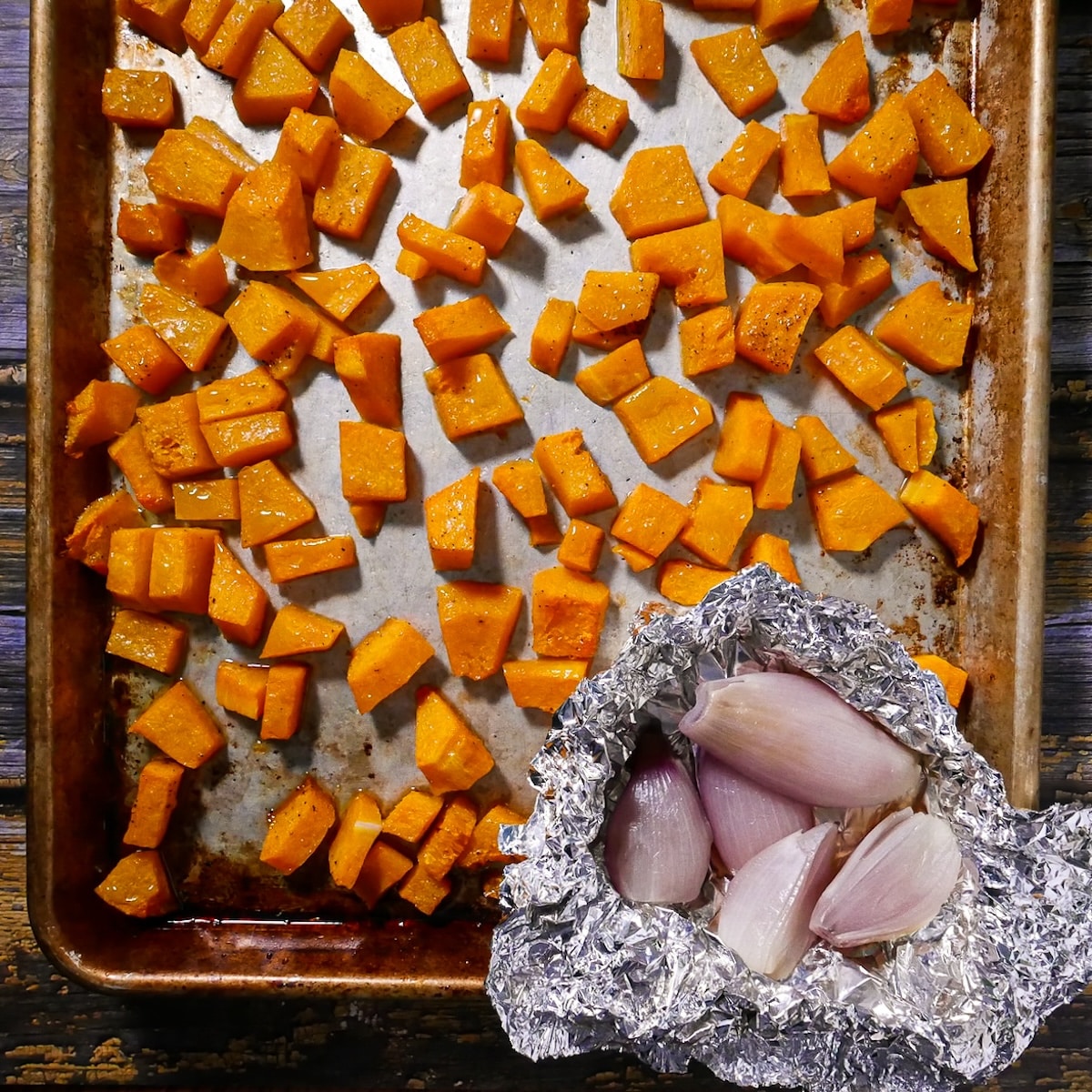 roasted-squash-and-shallots.jpg Roasted squash and shallots on a baking sheet.