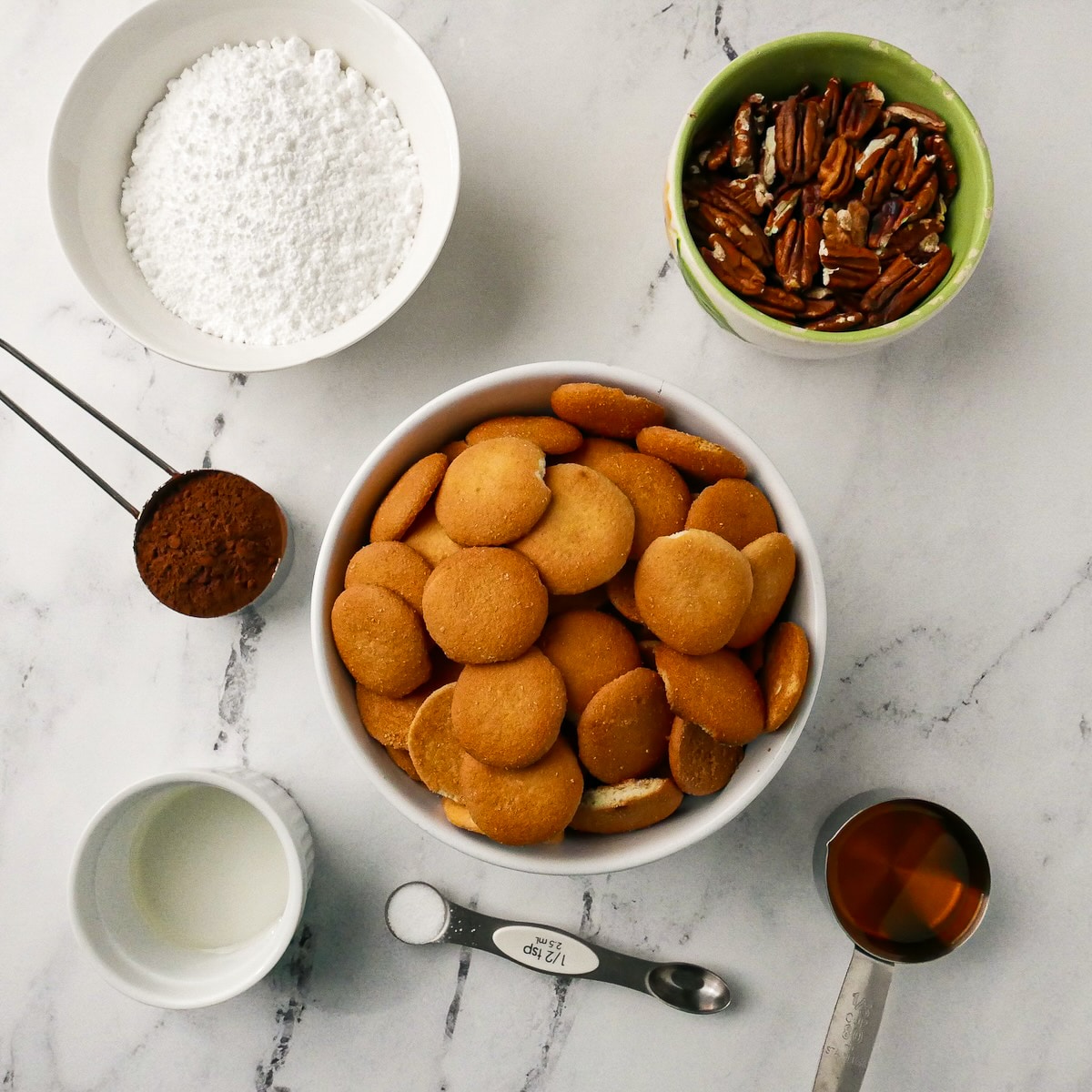 rum-ball-ingredients.jpg Ingredients for rum balls arranged on a table.