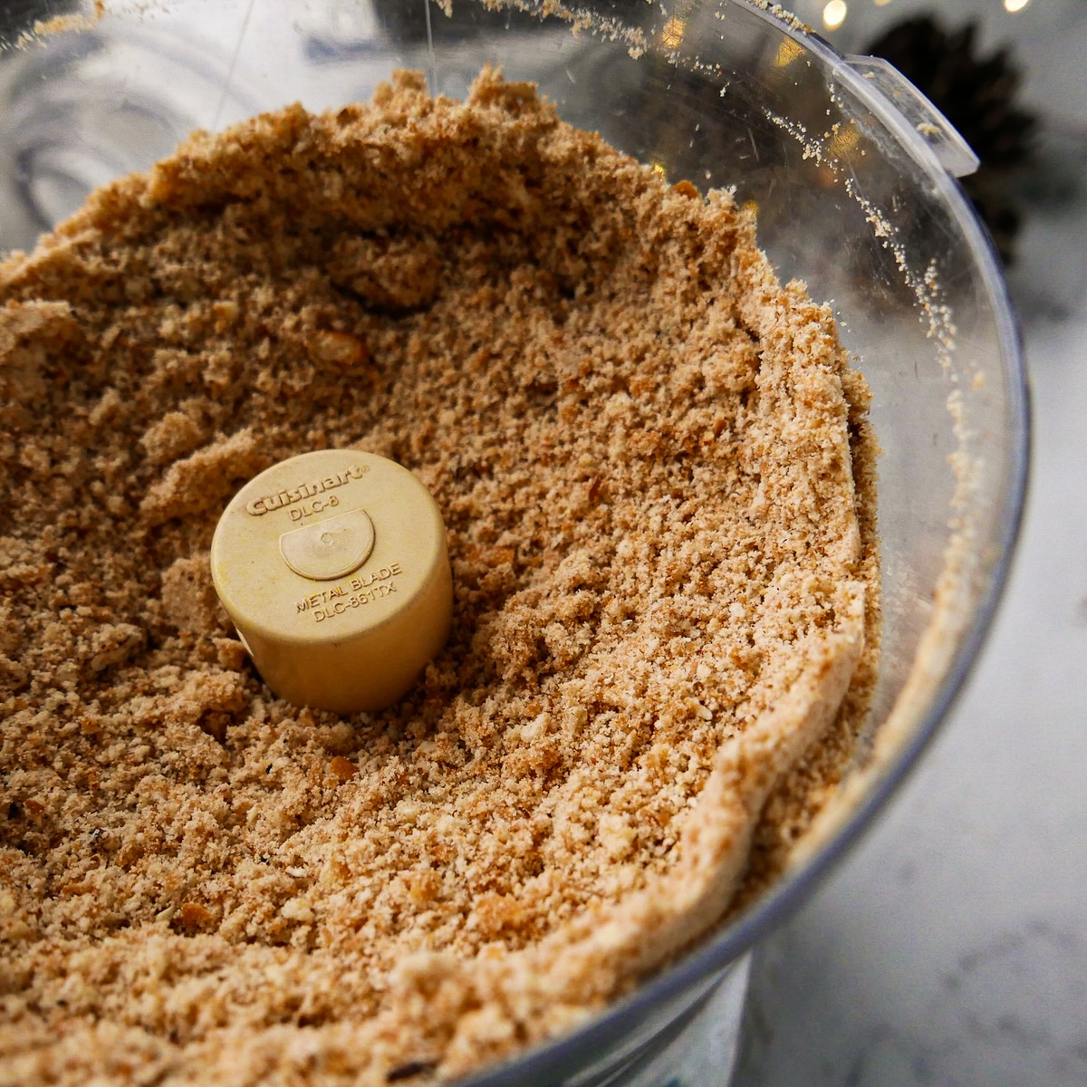 pecans-and-cookies.jpg Vanilla wafers and toasted pecans mixed in a food processor.