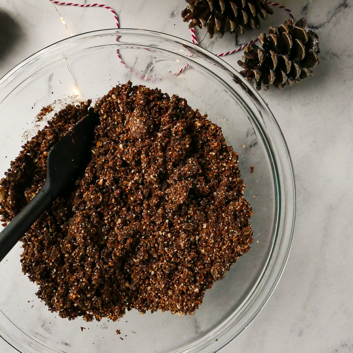 chocolate-rum-balls.jpg Cookie and pecan mixture added to sugar mixture.