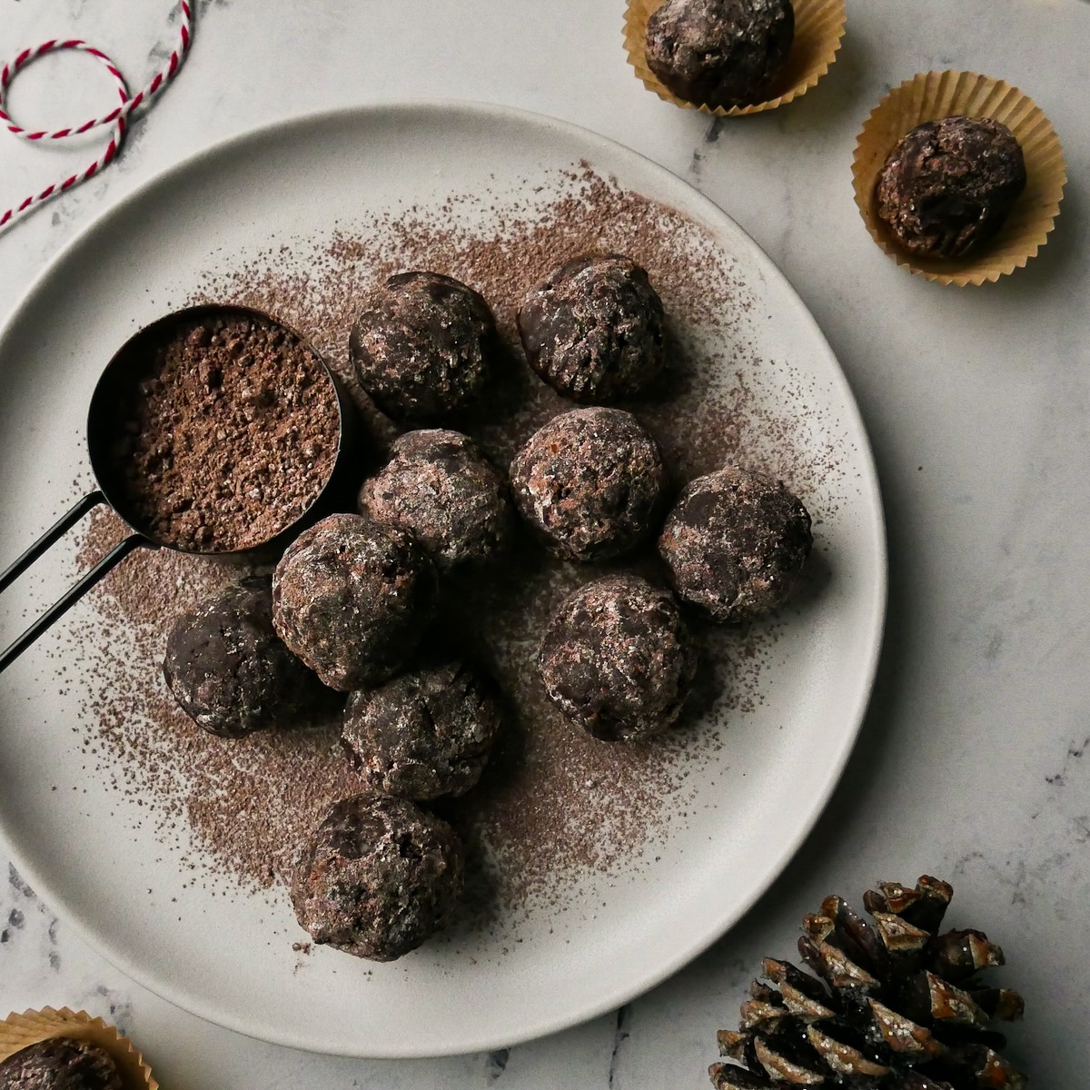 rum-balls-on-platter.jpg Easy rum balls with cocoa powder resting on a plate.