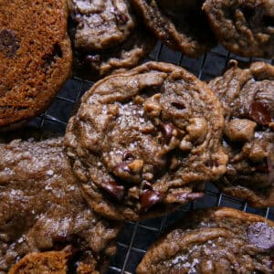 Gooey chocolate chip espresso cookies arranged on a wire rack.