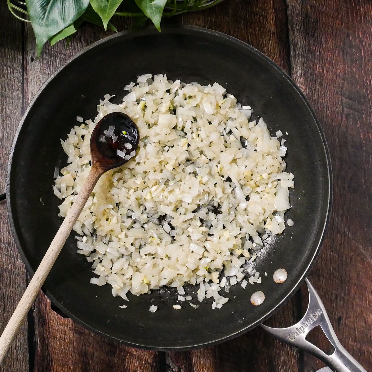 Onion and garlic cooking in a large skillet.