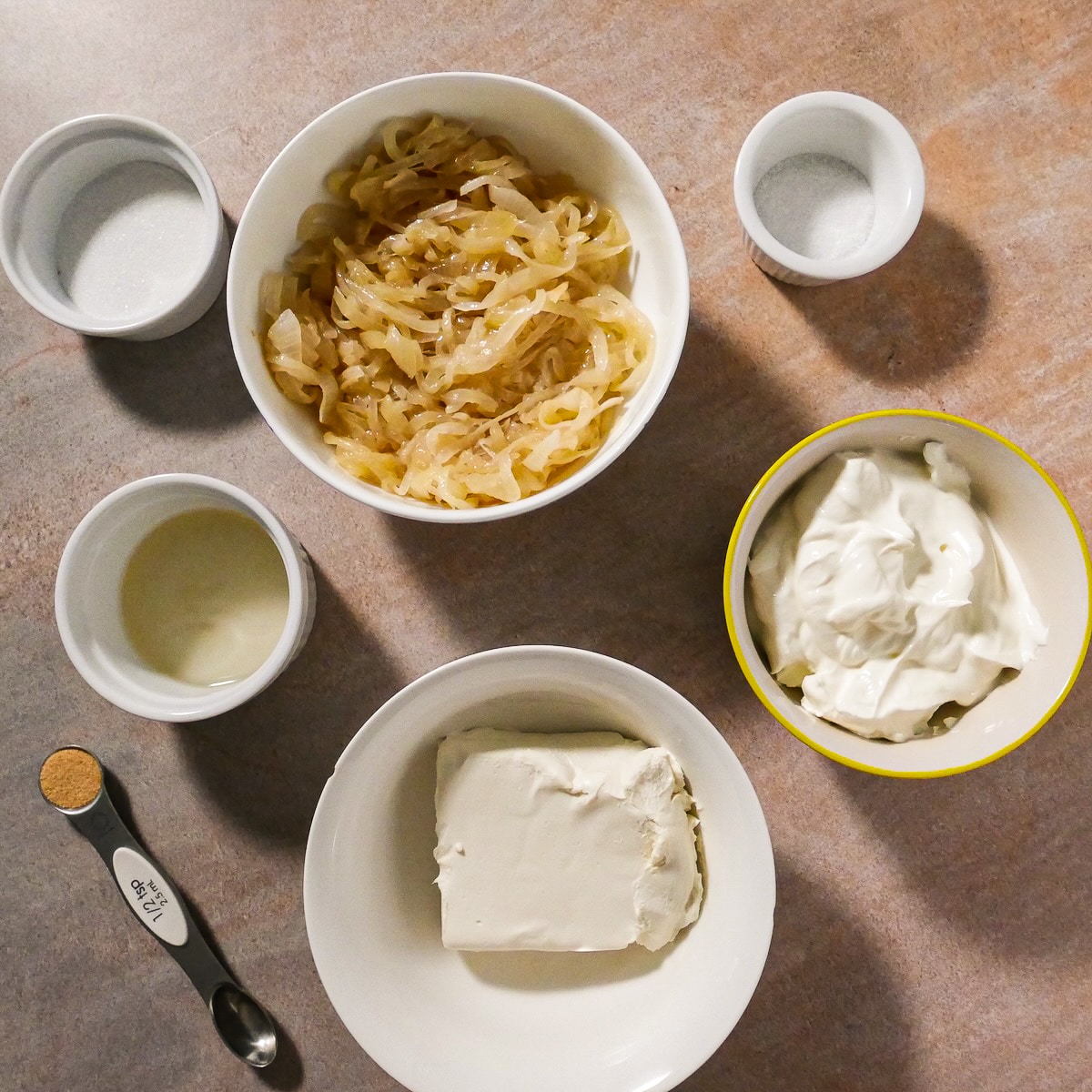 dip-recipe-ingredients.jpg Onion dip recipe ingredients arranged on a table.