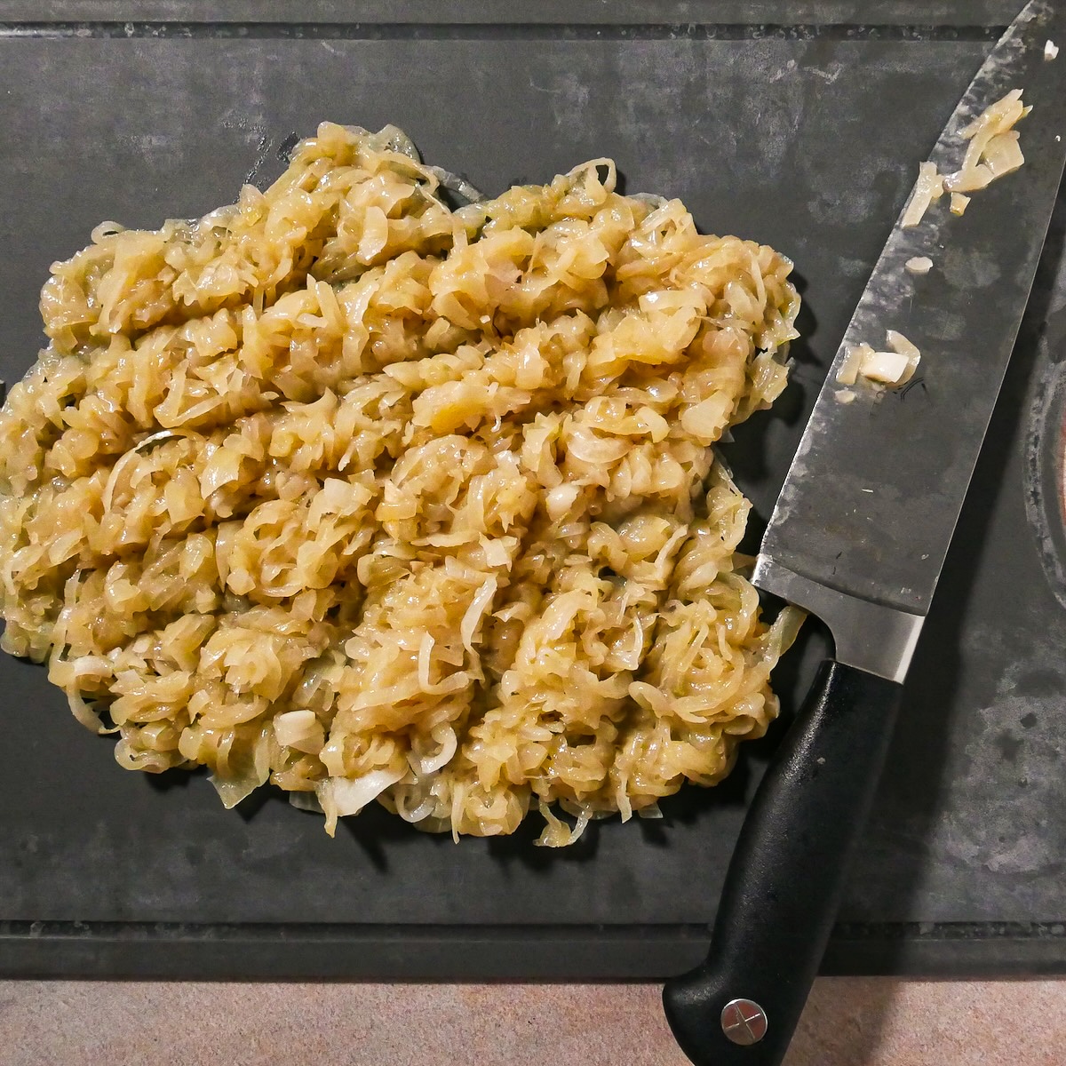 chopped-onions.jpg Coarsely chopped onions on a cutting board.