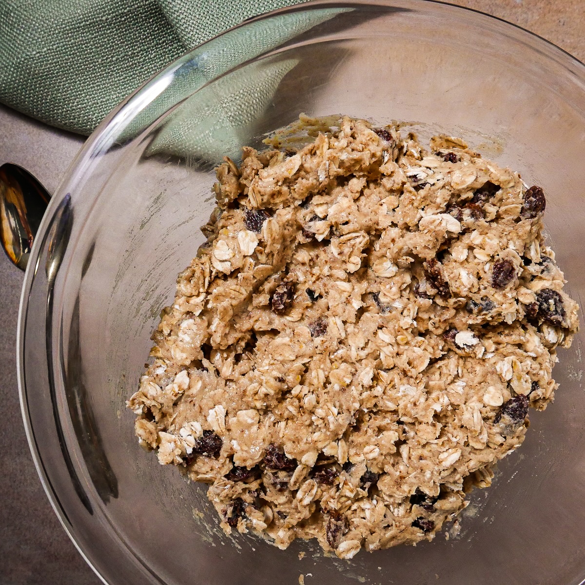Oatmeal raisin cookie dough mixed in a bowl. 