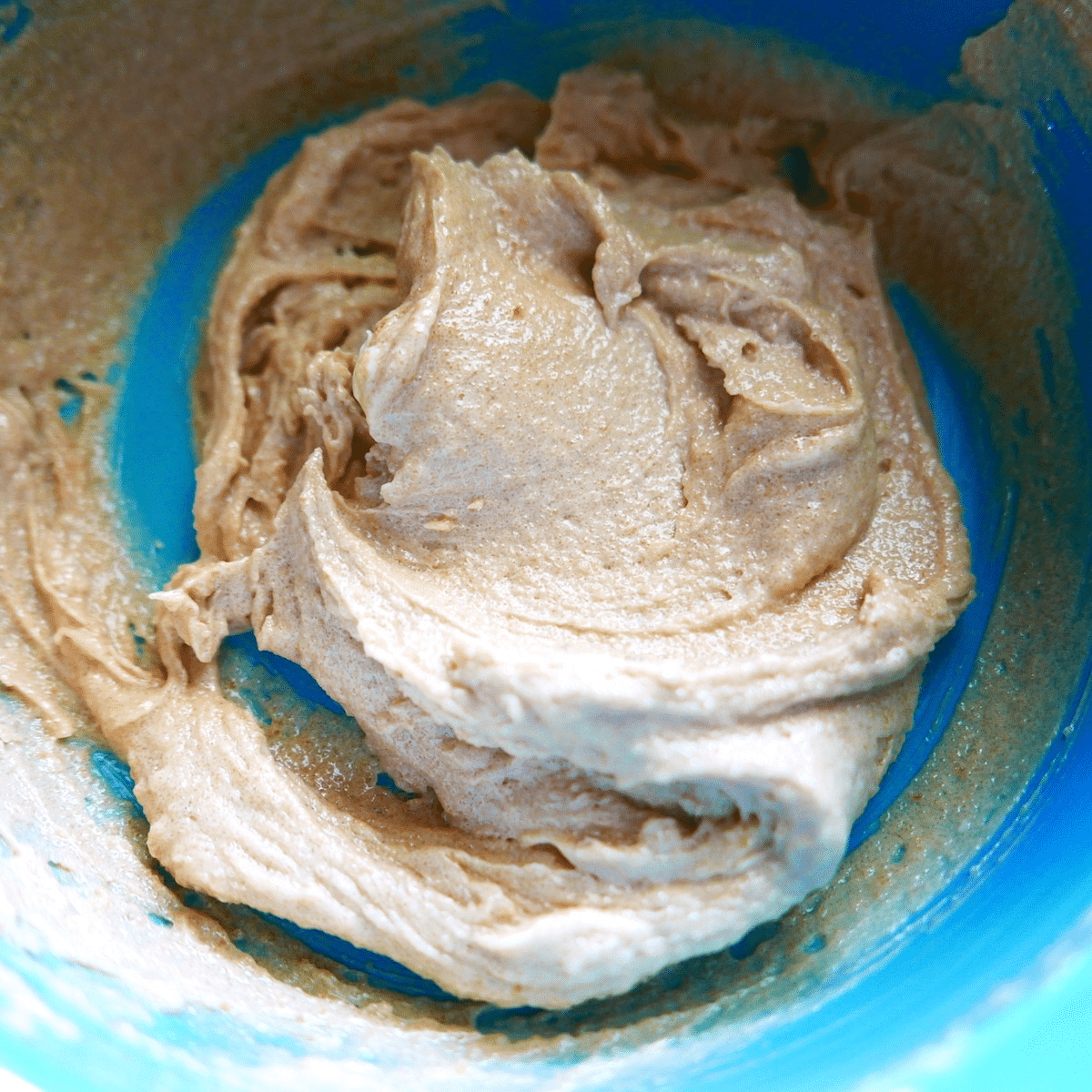 vegan butter, brown sugar, granulated sugar, flax egg, and vanilla extract mixed in a bowl. 