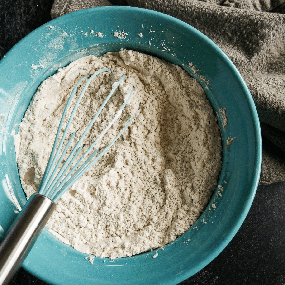 Dry ingredients whisked together in a bowl.