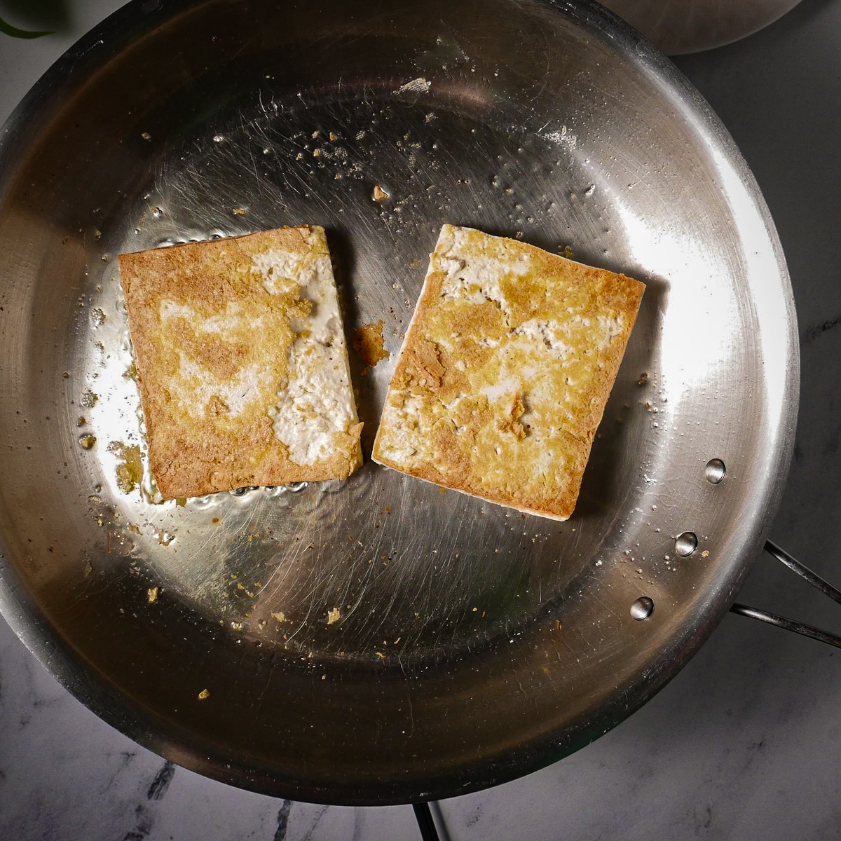 tofu-in-skillet.jpg Cooking tofu in a skillet.