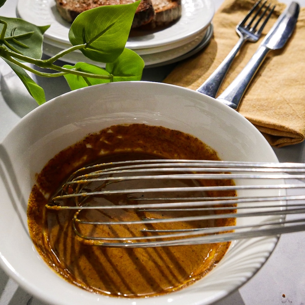 Eggy tofu sauce whisked together in a bowl.