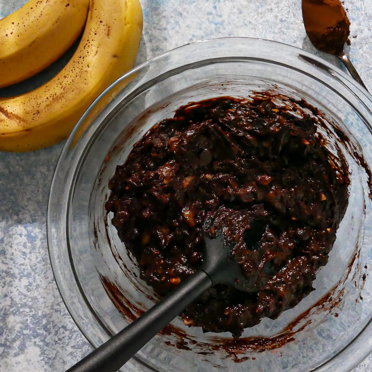 Cookie batter mixed together in a glass bowl.