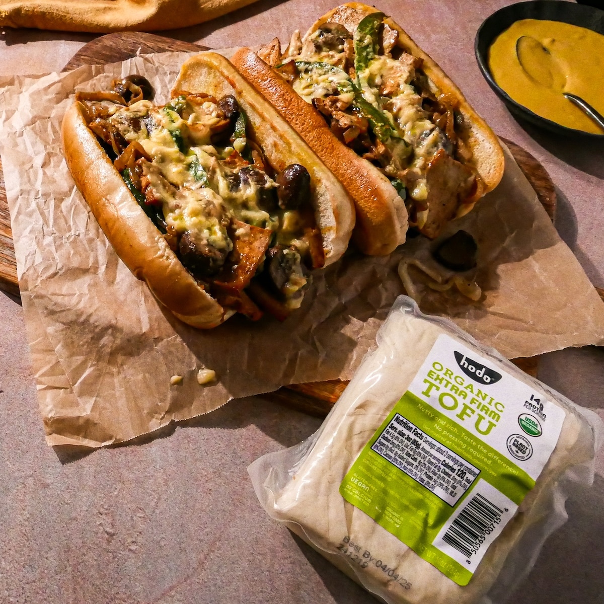 cheesesteak.jpg Vegan philly cheesesteak on a table.