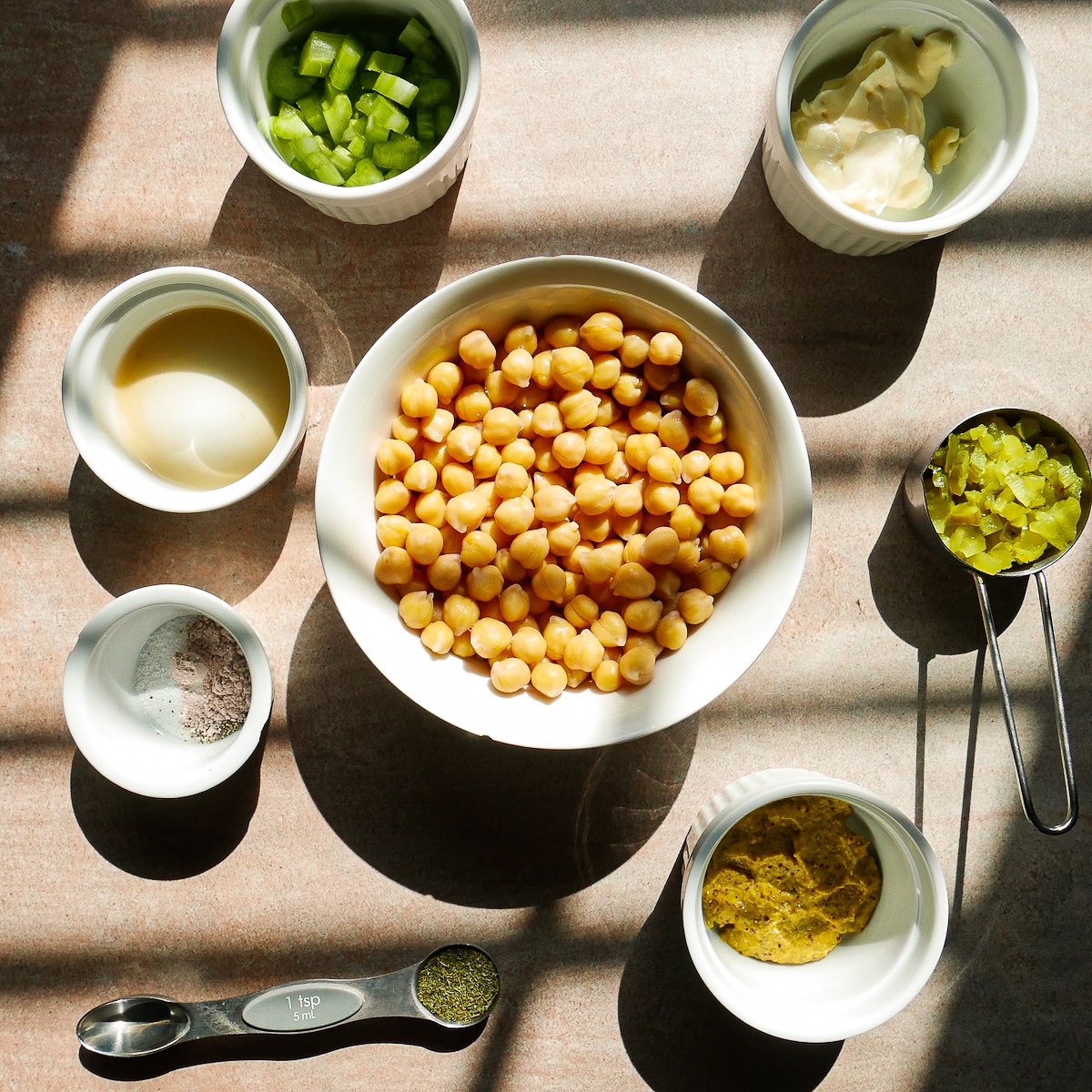 Vegan sandwich ingredients arranged on a table.