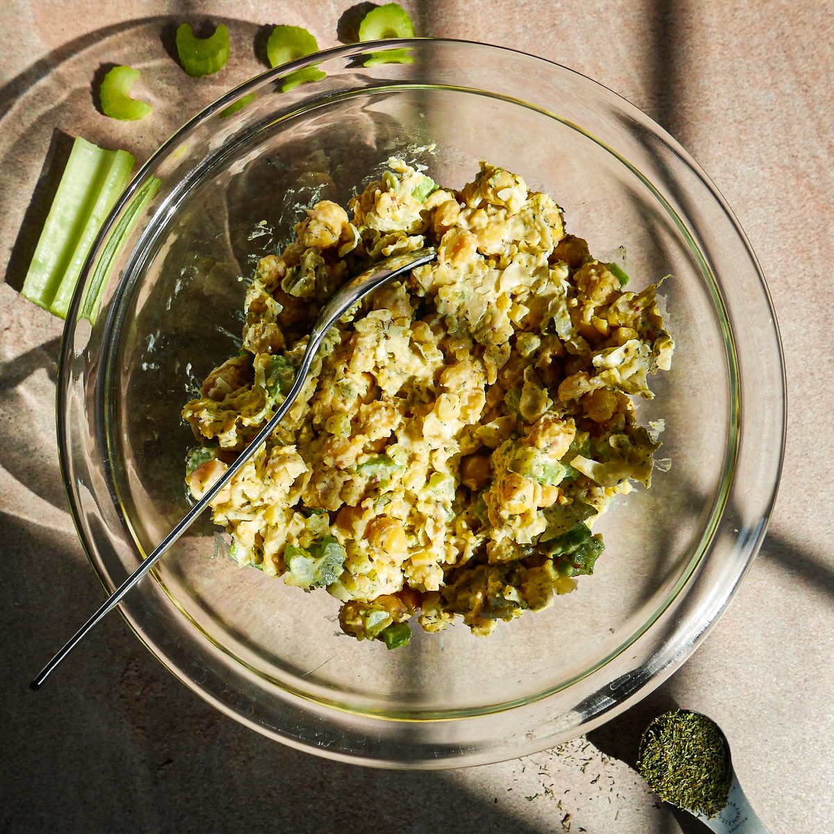 Creamy vegan egg salad mixed in a bowl.