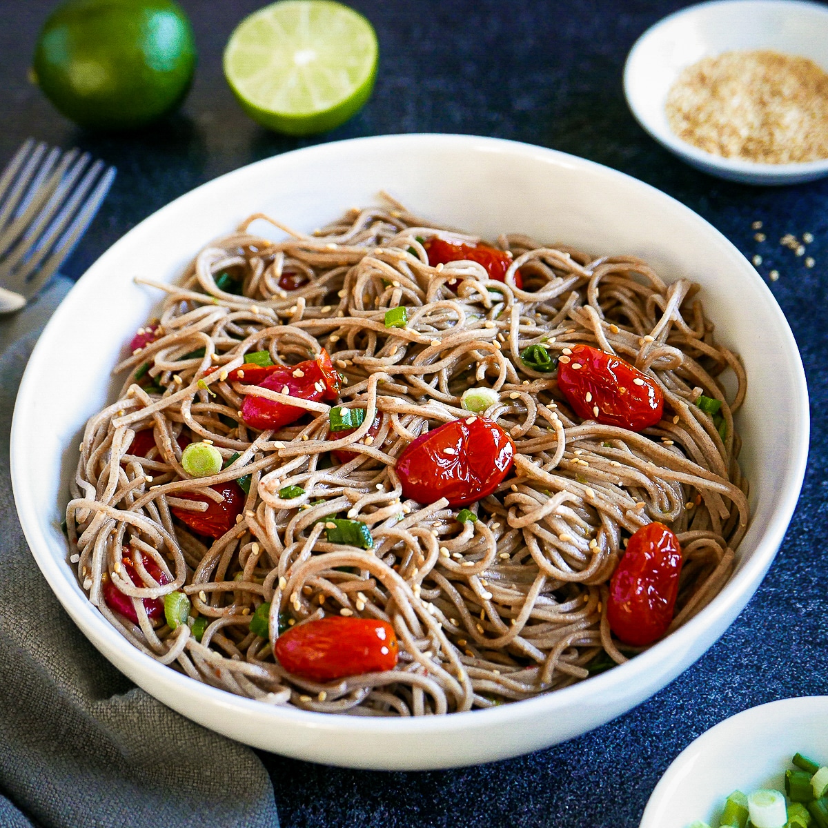 miso-noodles-in-bowl.jpg Spicy miso noodles with roasted tomatoes in a white bowl with two forks.