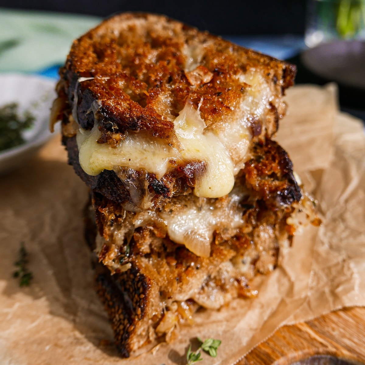 Cheesy French onion grilled cheese on buttered sourdough bread. 