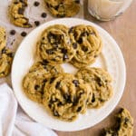 Chewy dairy free chocolate chip cookies arranged on a plate.