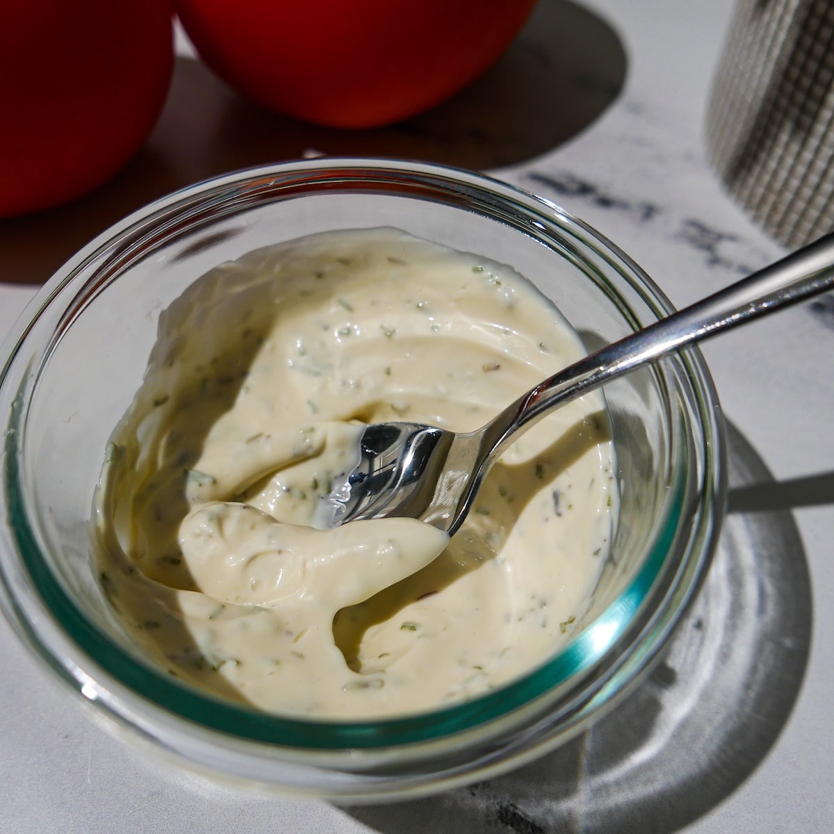 rosemary-mayo.jpg Mayonnaise and dried rosemary mixed in a small bowl.