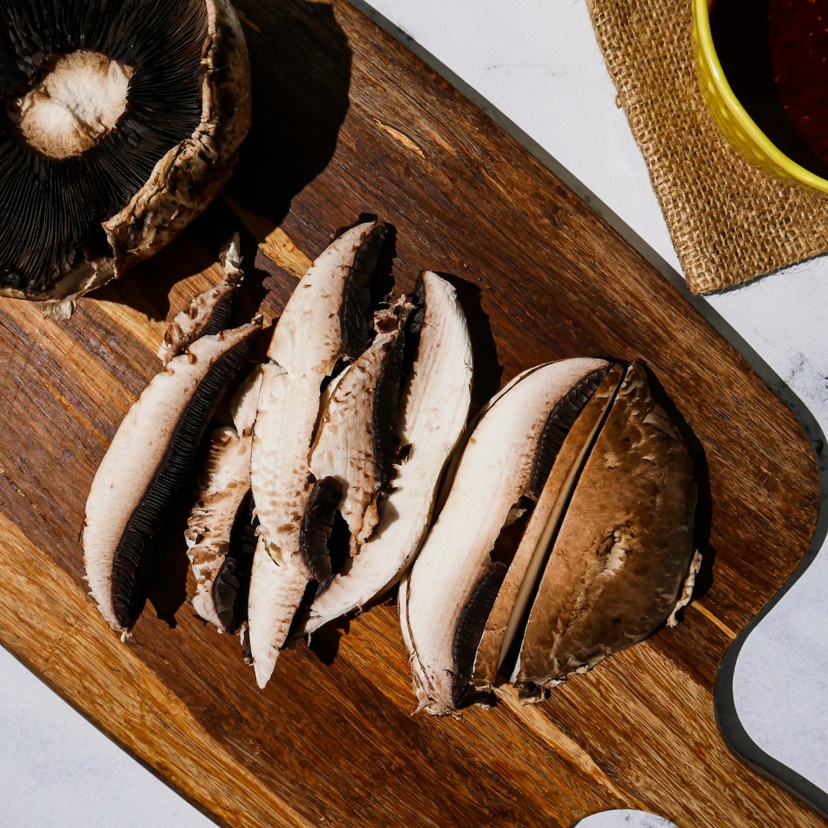 slicing-mushrooms.jpg Thinly slicing portobello mushrooms.